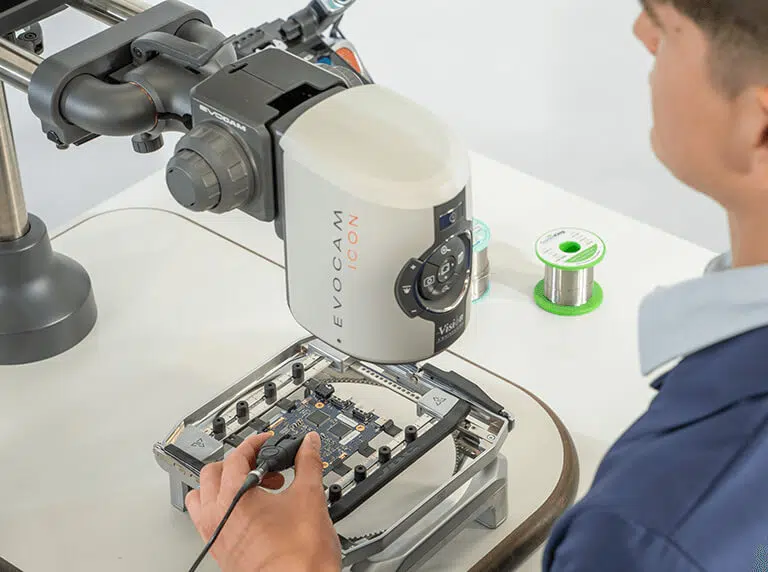 EVO Cam ICON digital microscope being used for hand soldering by man
